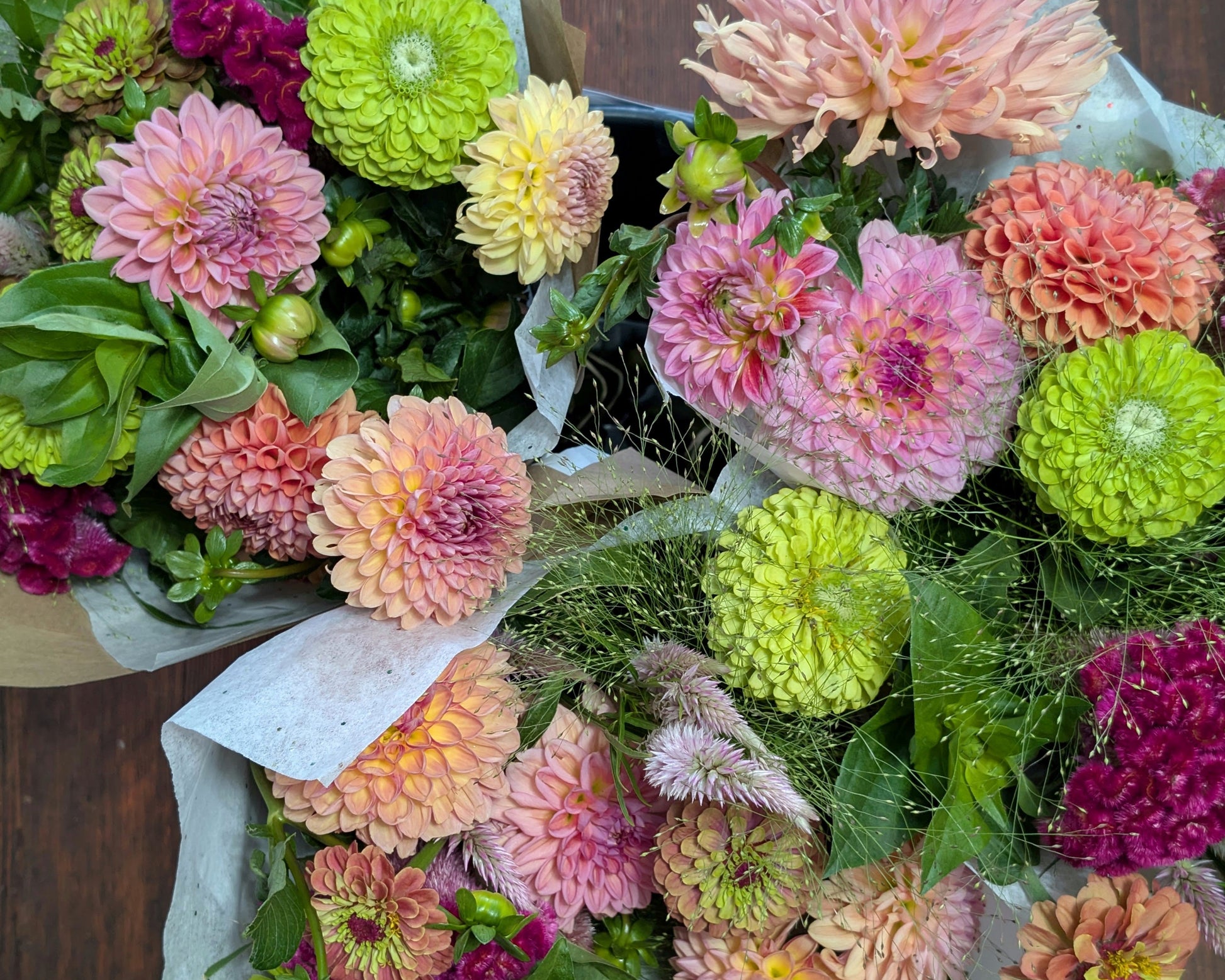 Bouquet of colorful flowers on a wooden surface